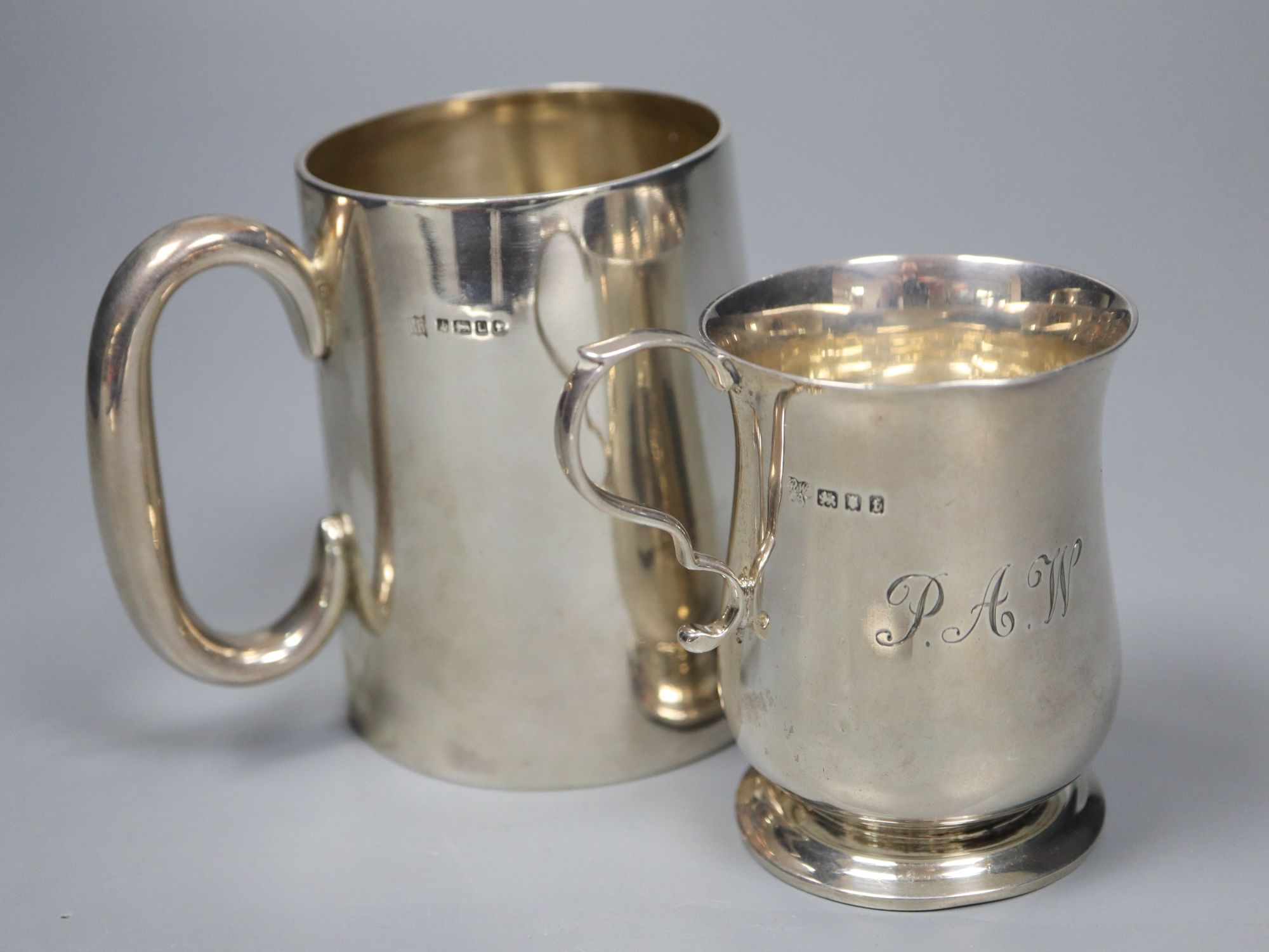 A Victorian silver christening mug, 89mm and an Edwardian silver christening mug, 76mm, gross 7.5 oz.
